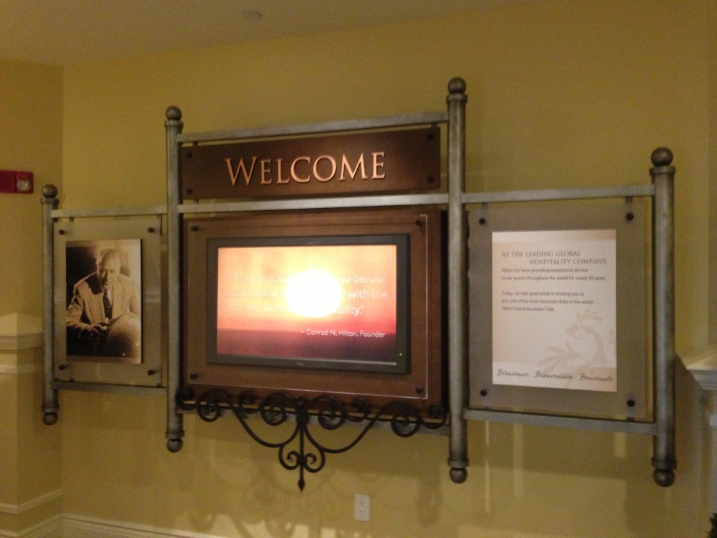 parc soleil hilton grand vacations sales center welcome sign with message from founder conrad hilton