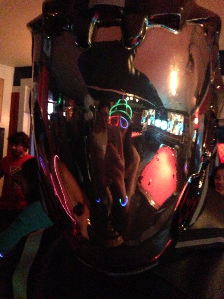 reflection in shiny tron helmet at gogobot tron themed party