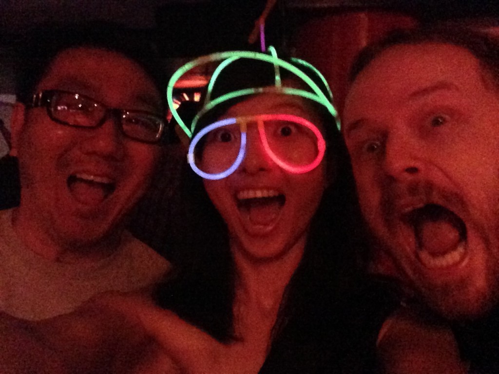 three super happy friends at gogobot tron themed party