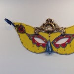 metal mask artwork on display in sfo