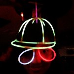 girl with glowstick baseball cap and glasses