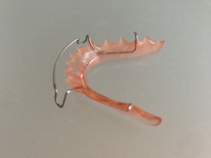 pink plastic and metal retainer