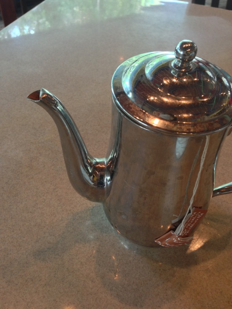 silver tea pot with spill-free spout