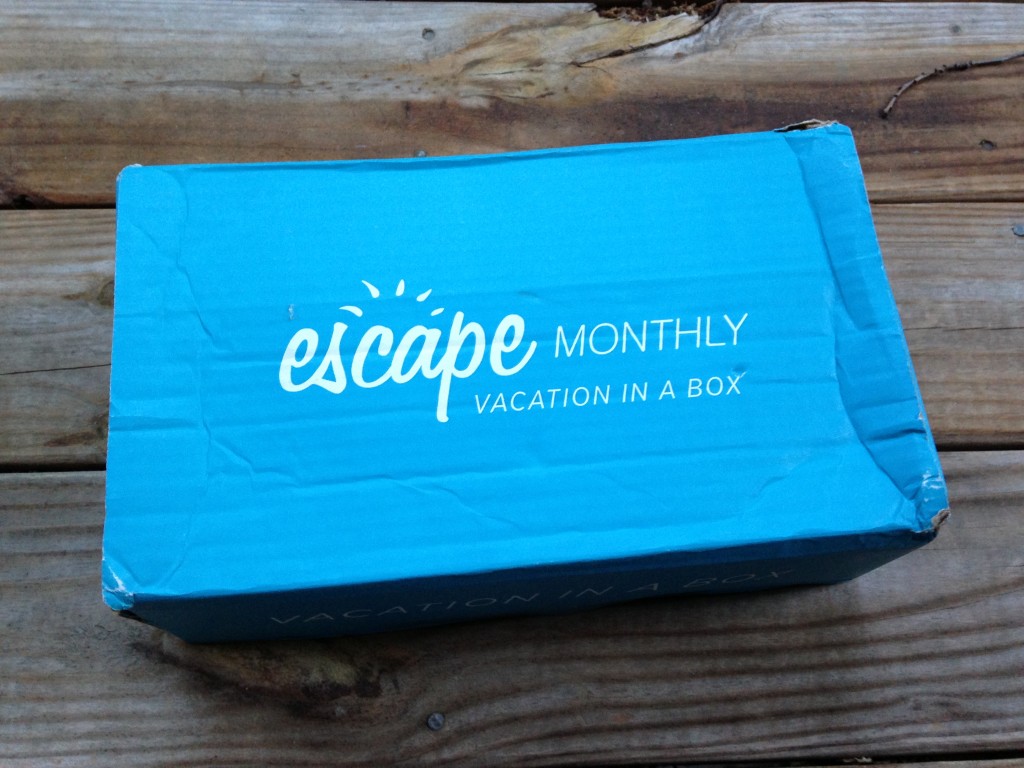 blue escape monthly box with white lettering