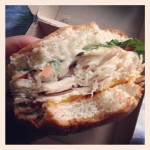 arby's turkey club sandwich half-eaten side view
