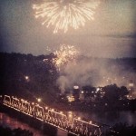 fireworks in harrisburg over lighted bridge