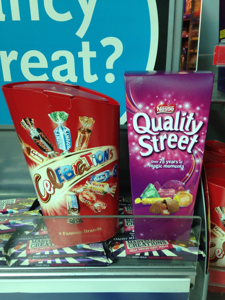 boxes of celebrations and quality street candies