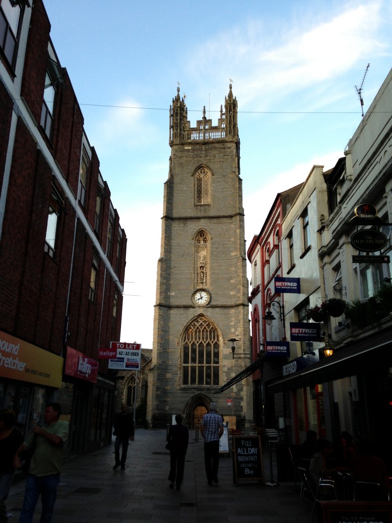 church clock tower against blue sky in cardiff