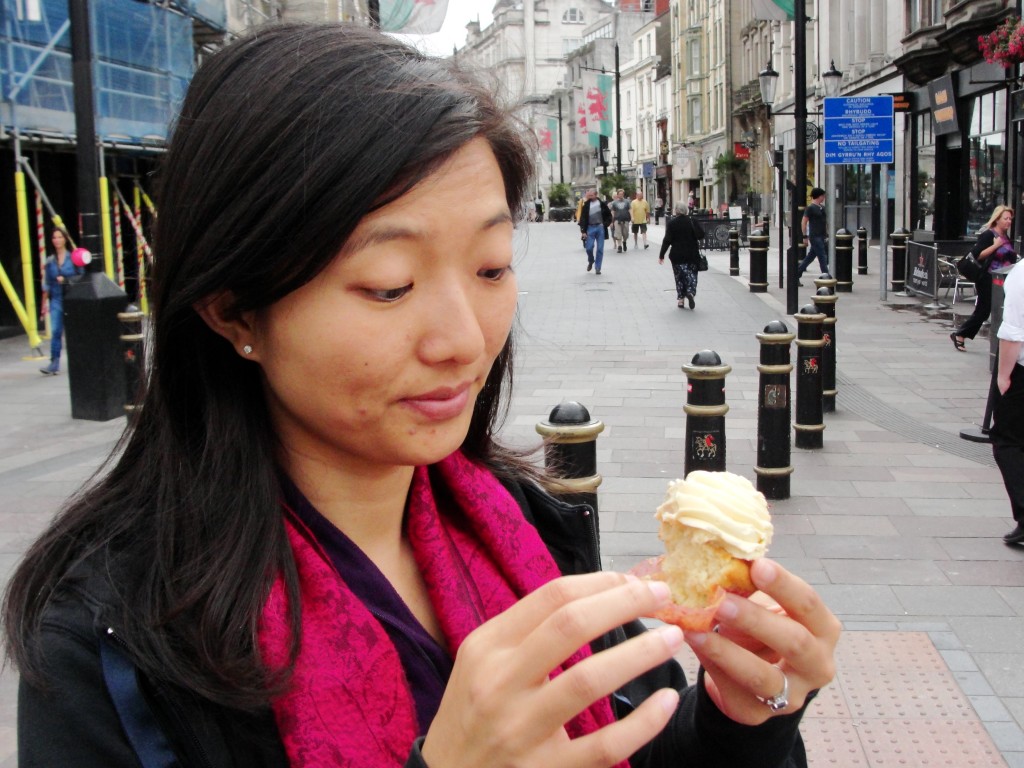 pausing to eat cupcake in middle of street in cardiff