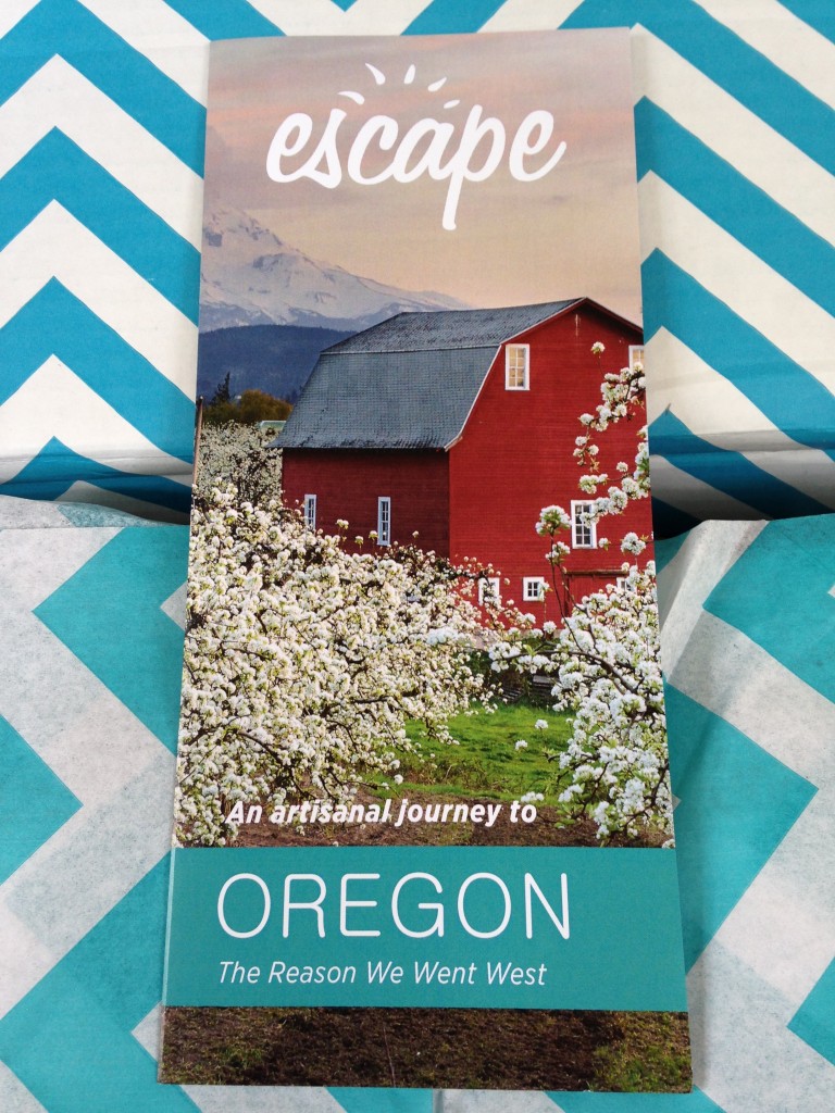 escape monthly september oregon box info card against blue and white chevron background