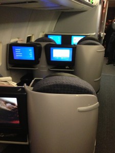 first class international seats with large tv screens and comfortable sleeping