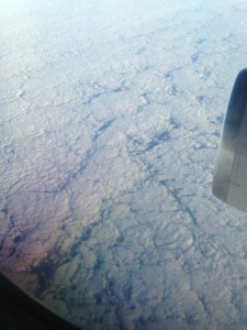 thick blanket of cloud coverage below flying plane in flat pattern