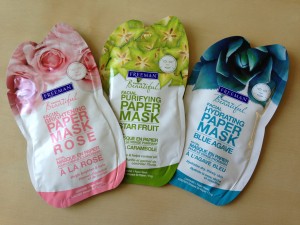 three freeman facial paper masks in brightening rose, purifying star fruit, and hydrating blue agave