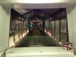 view of tunnel between terminals at washington dulles international airport from inside aerotrain