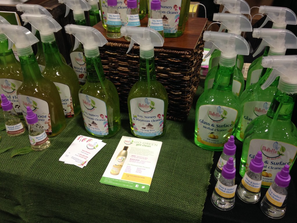 muffetta cleaning products including wood floor cleaner, nursery cleaner, and glass & surface cleaner bottles at green festival dc 2013