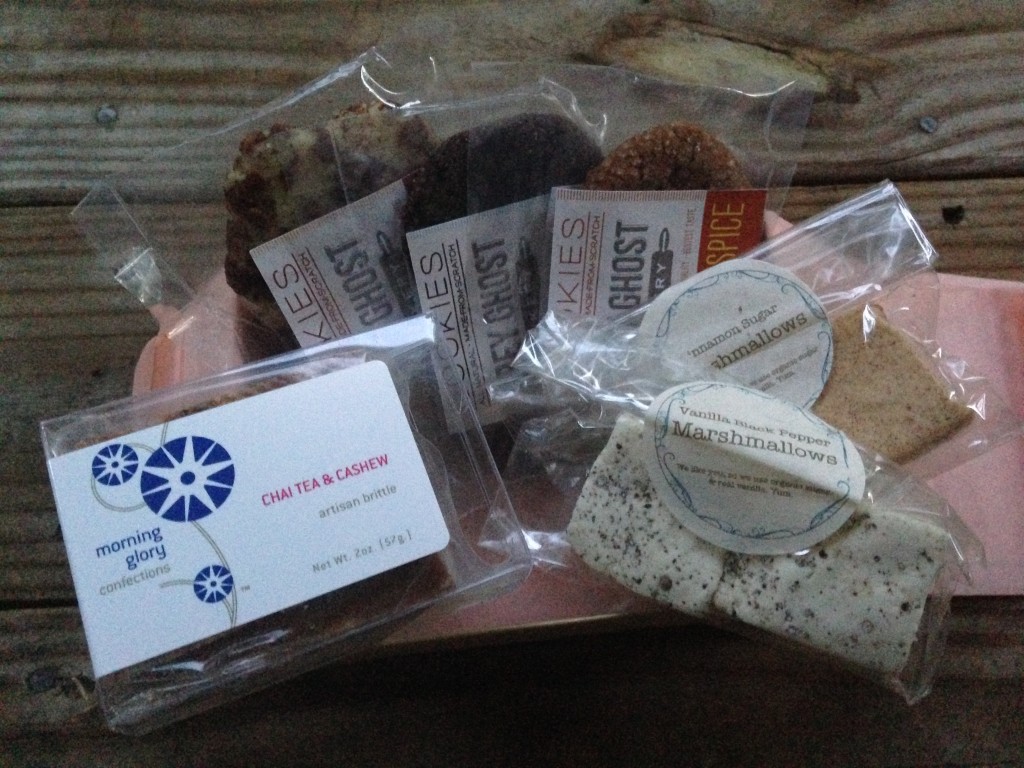 treatsie september box contents with nut brittle, cookies, and marshmallow squares