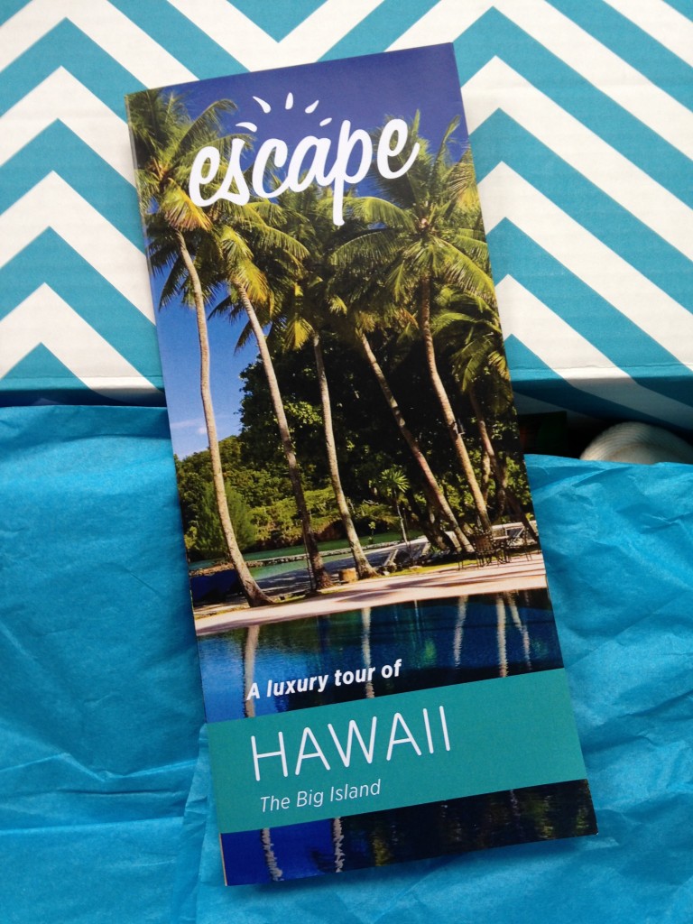 escape monthly october hawaii box info card against blue and white chevron background