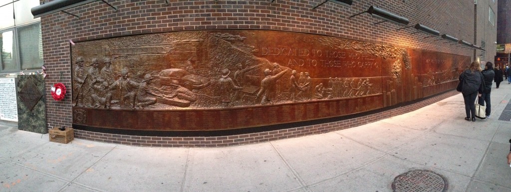 panoramic of 9/11 memorial mural along new york city sidewalk
