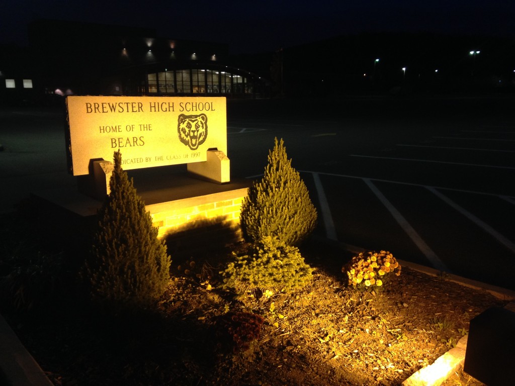 stone brewster high school sign lit up at night