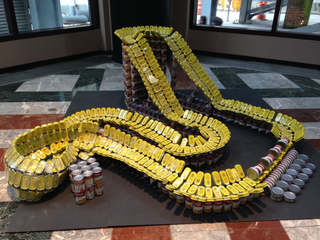 canstruction rollercoaster sculpture made of cans