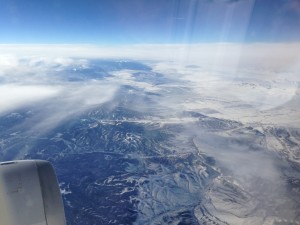 flying over colorado mountains covered in snow