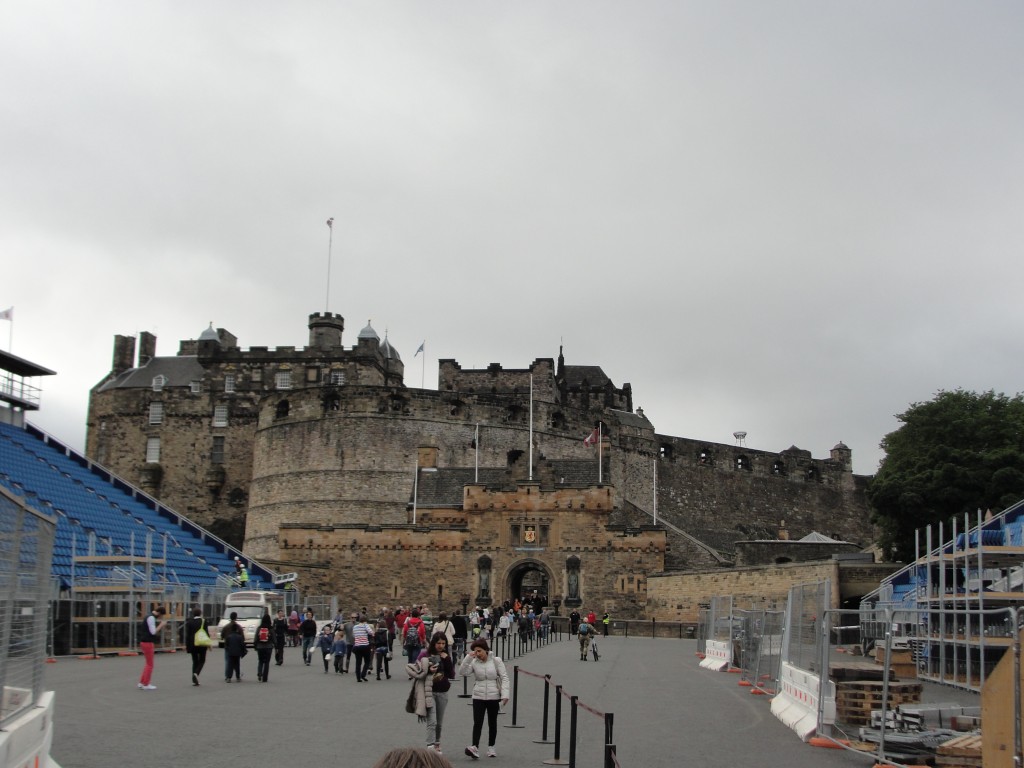 entrance to edinburgh castle atop hill with temporary bleachers set up