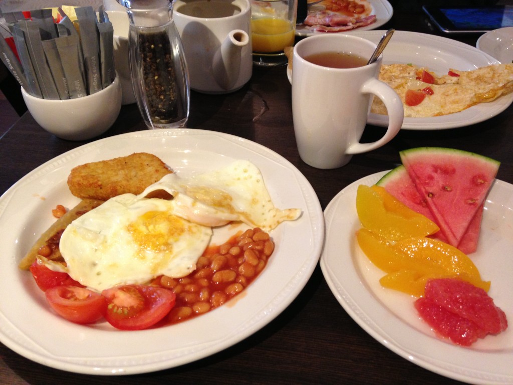 english breakfast at hilton edinburgh with fried eggs, baked beans, tomatoes, hash browns, tea, omelette, and fruit