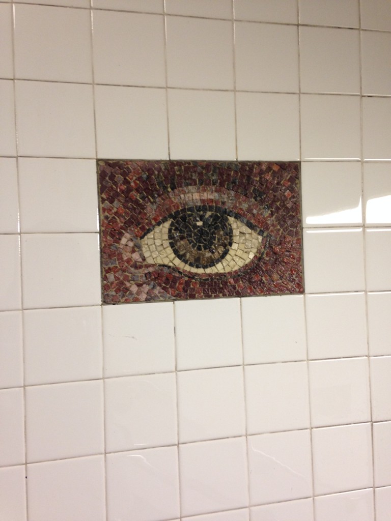 eye mosaic on subway station wall