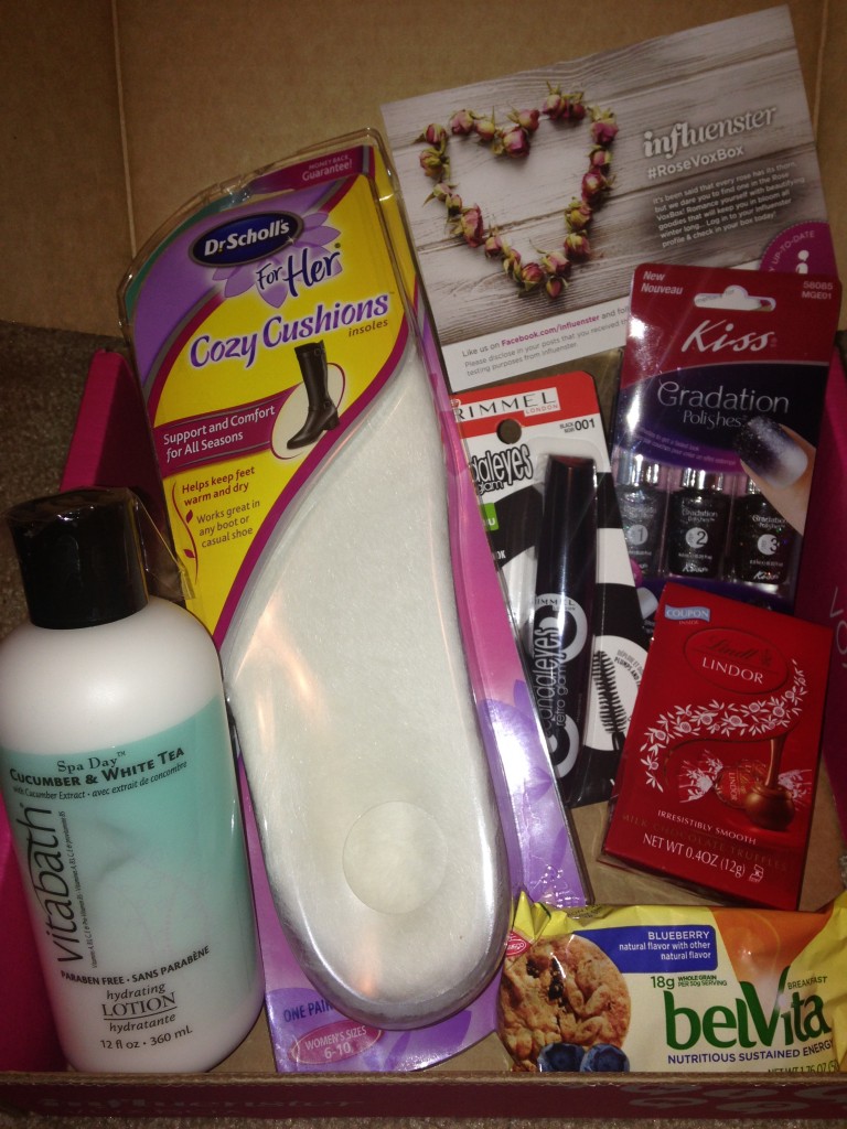 contents of influenster rose voxbox with vitabath lotion, dr scholl's cozy cushions, rimmel mascara, kiss gradation nail polish kit, lindor chocolates, and belvita biscuits