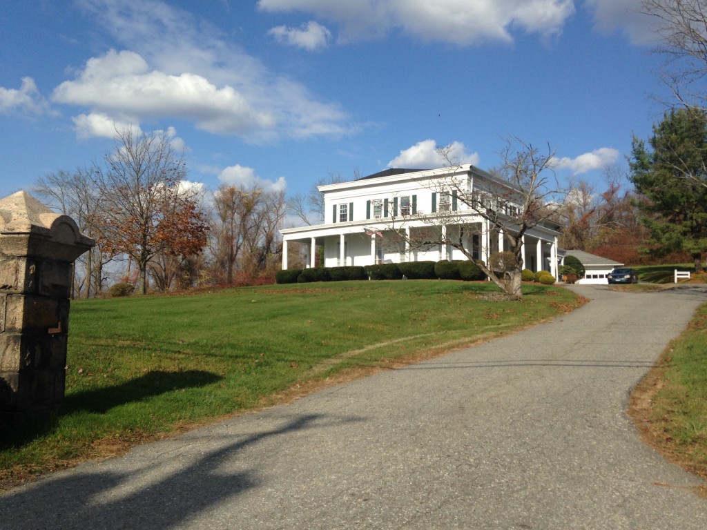 large white house with long driveway in brewster new york