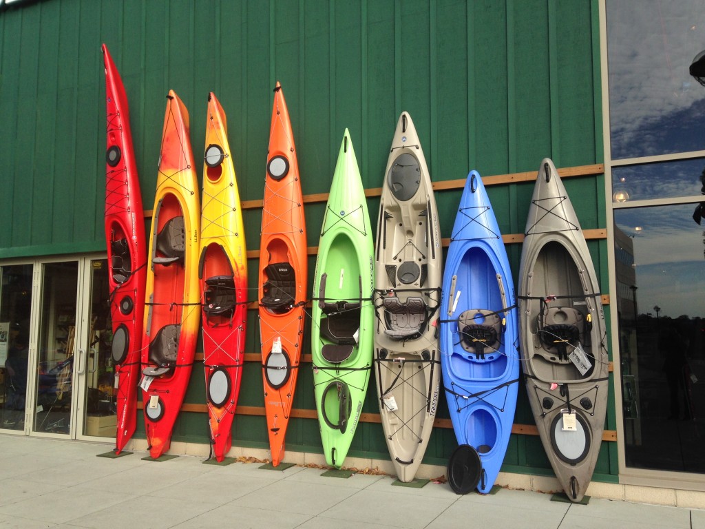 colorful kayaks lined up outside ll bean store