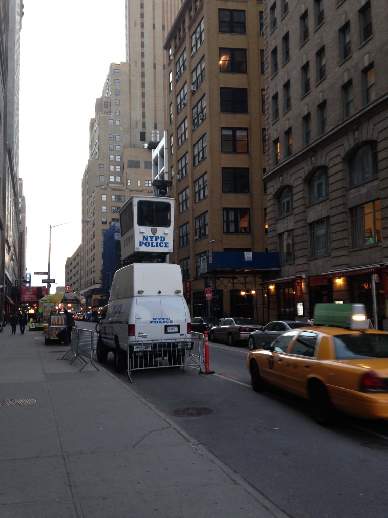 nypd police truck with viewing unit sitting atop it