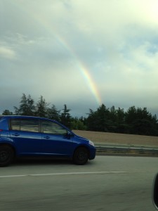 rainbow seen by freeway while driving