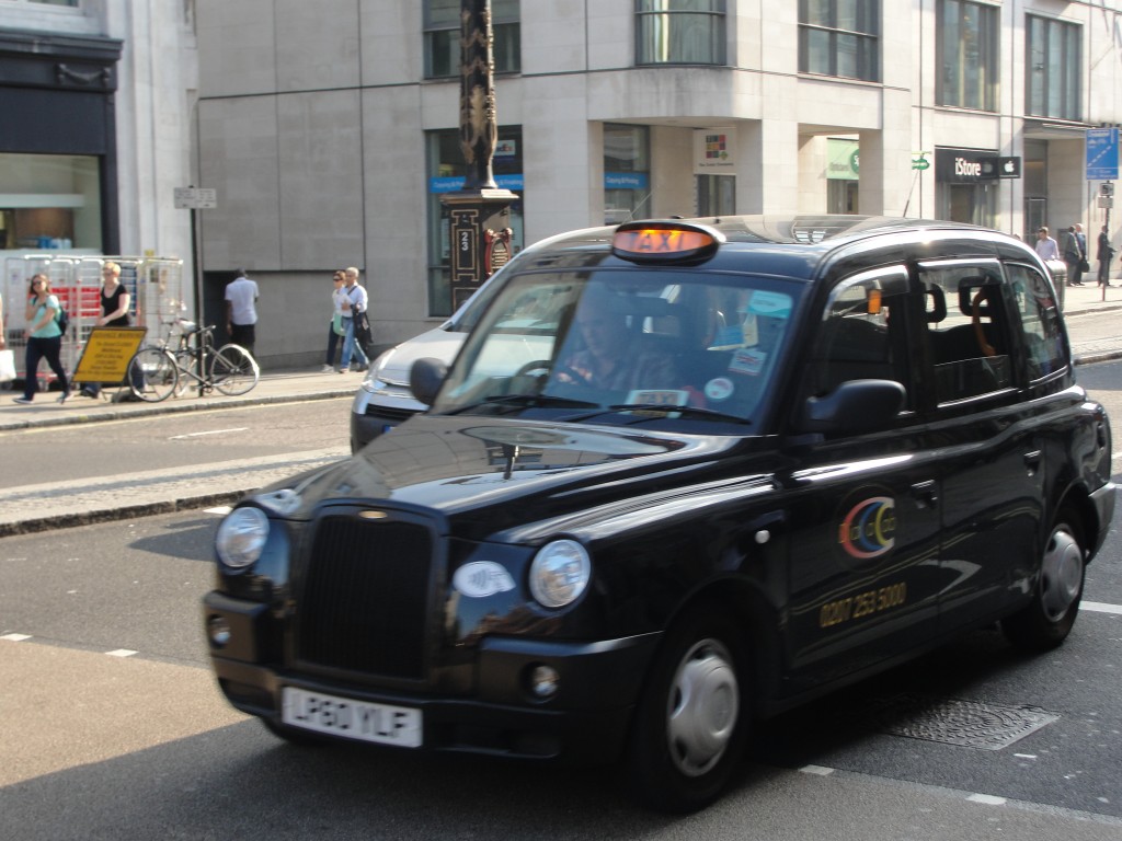 black british taxi on london streets