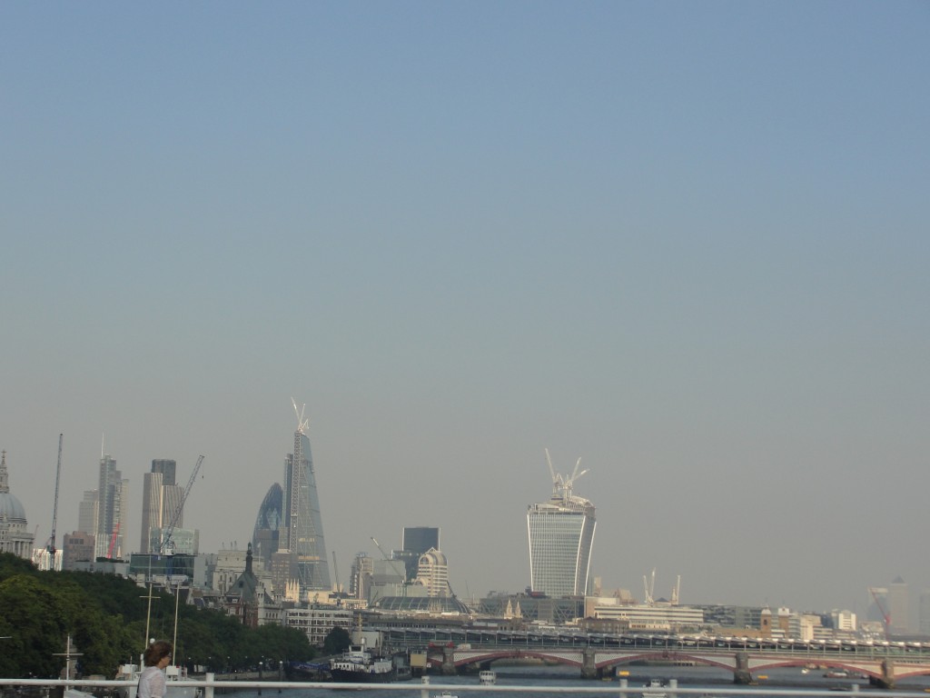 view of eastern london buildings from waterloo bridge