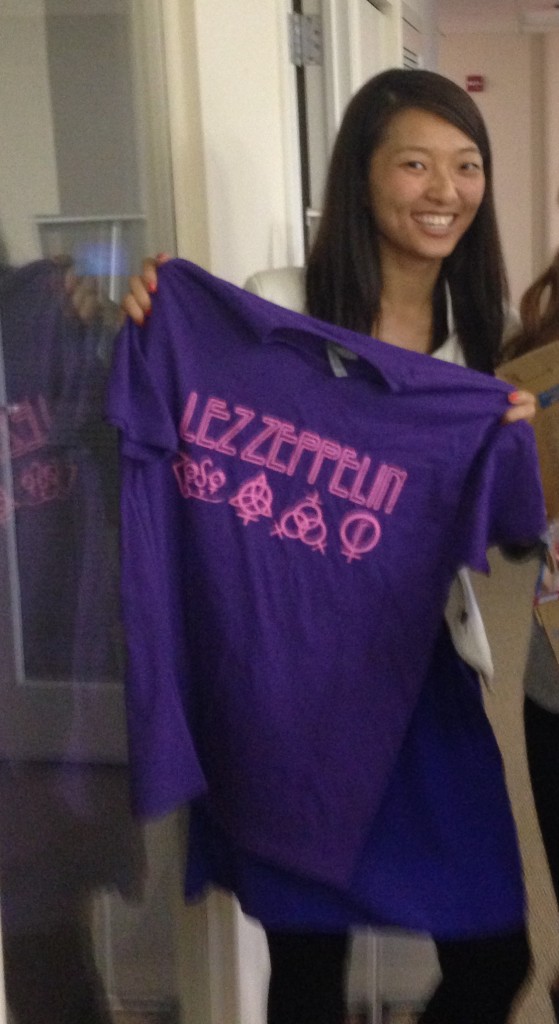 posing with purple and pink lez zeppelin t-shirt from white elephant gift exchange