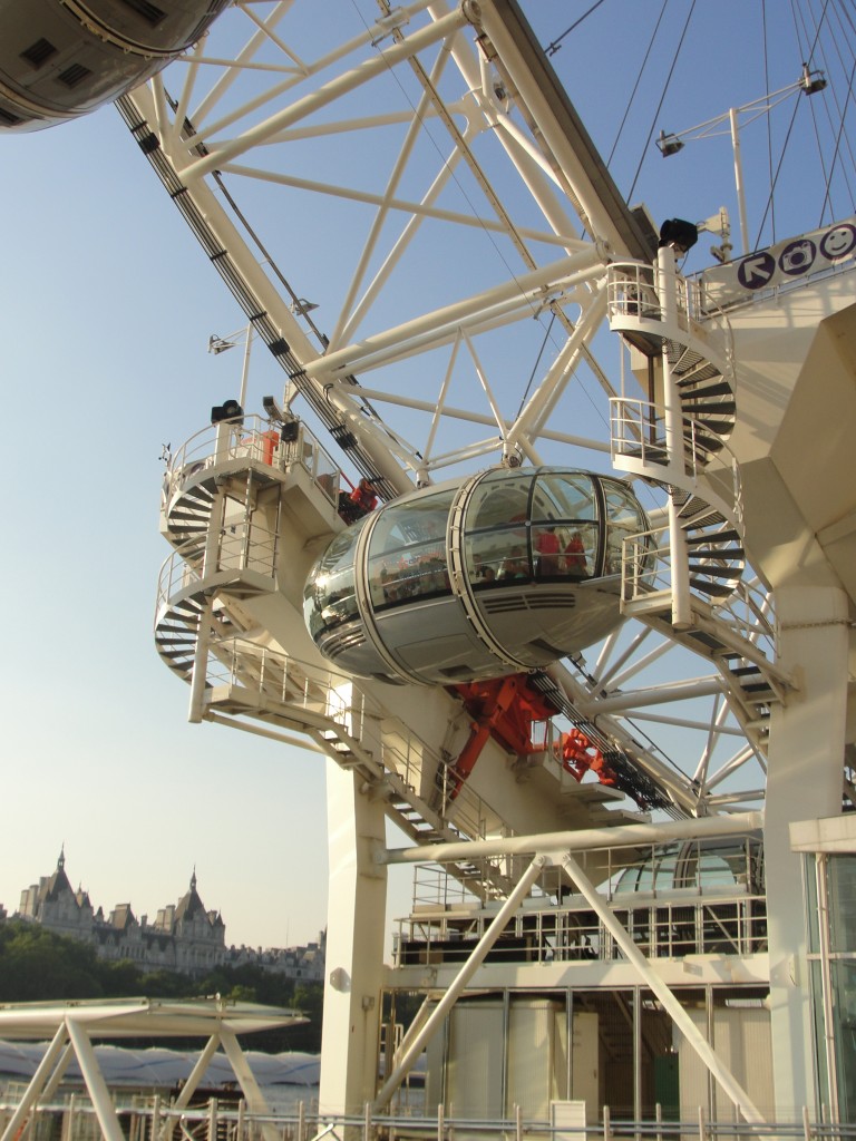 view of people standing in pod of london eye as it slowly goes up