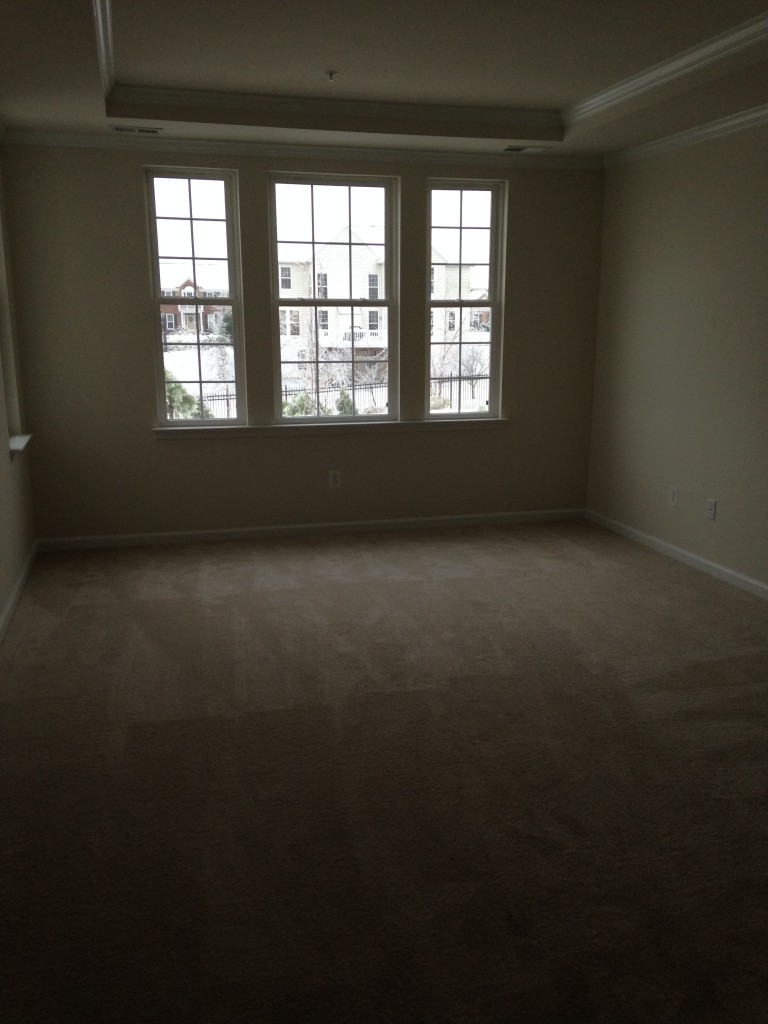 master bedroom in new condo with tray ceiling