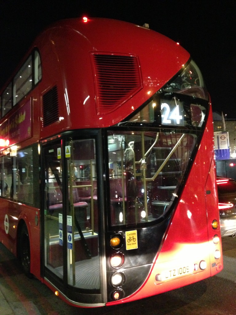 rear of modern red double decker bus in london with lots of windows