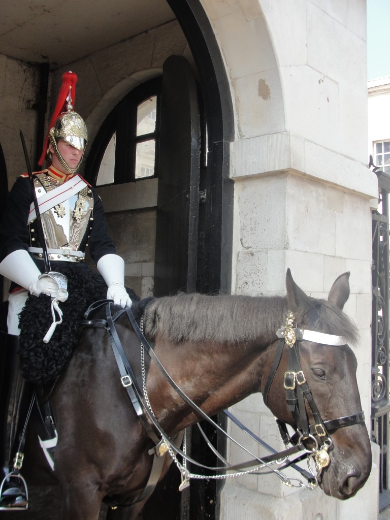 mounted guard sitting on horse guarding gate