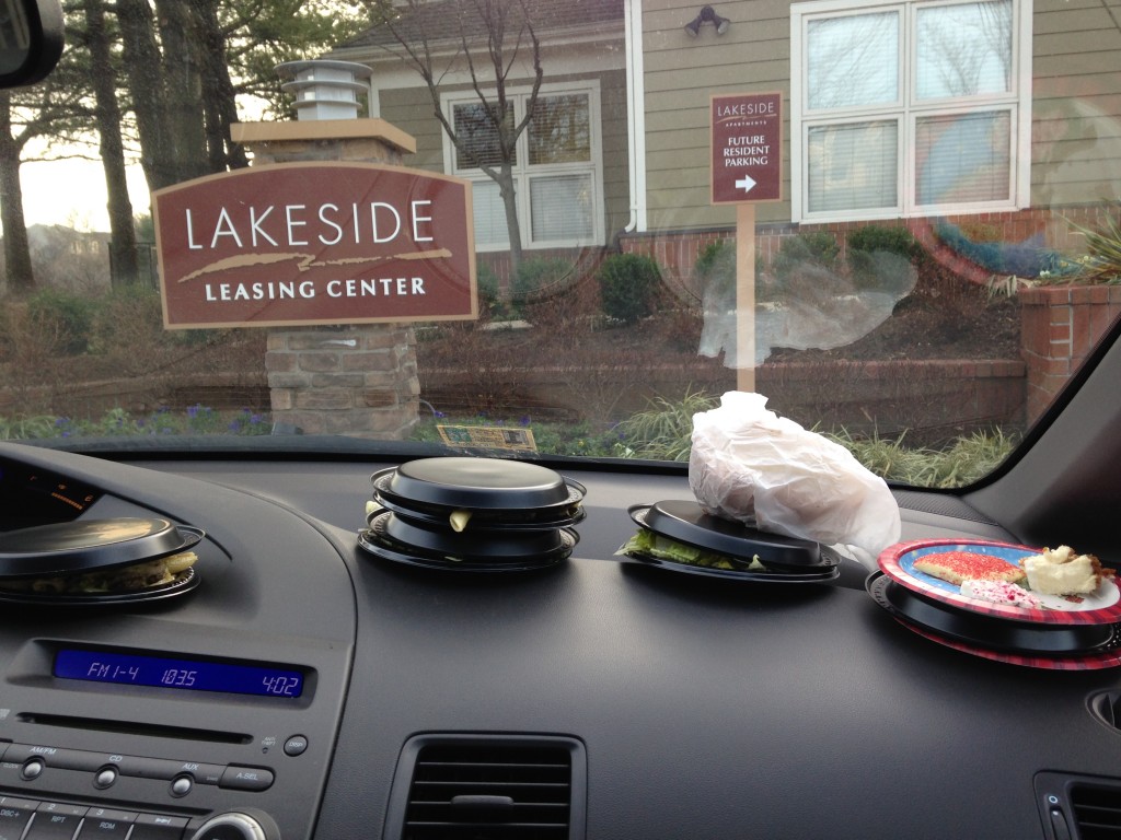 pile of plates of food sitting on dashboard of car