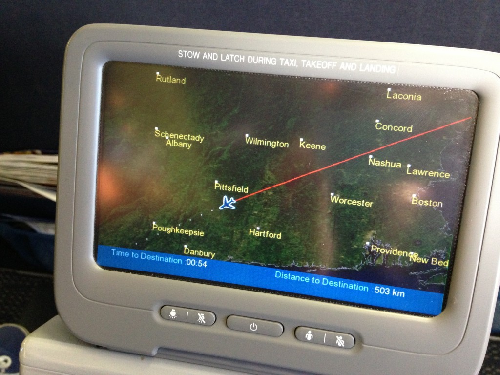 map of flight route on tv screen of airplane