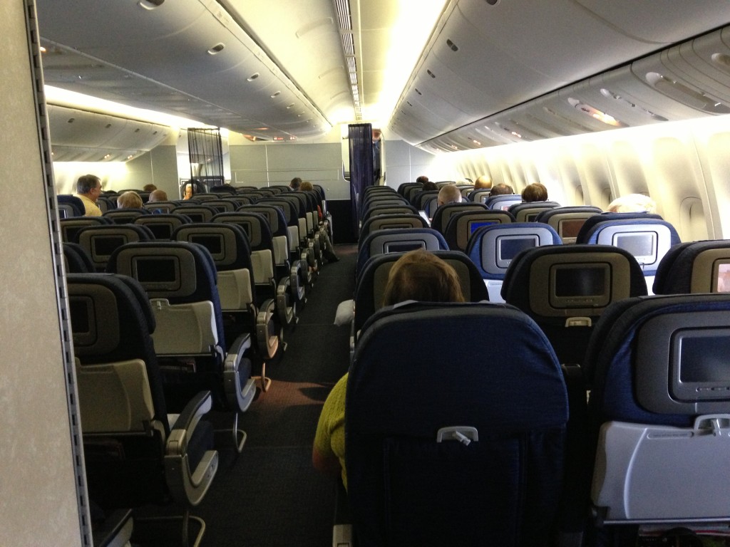 rows of airplane seats from back