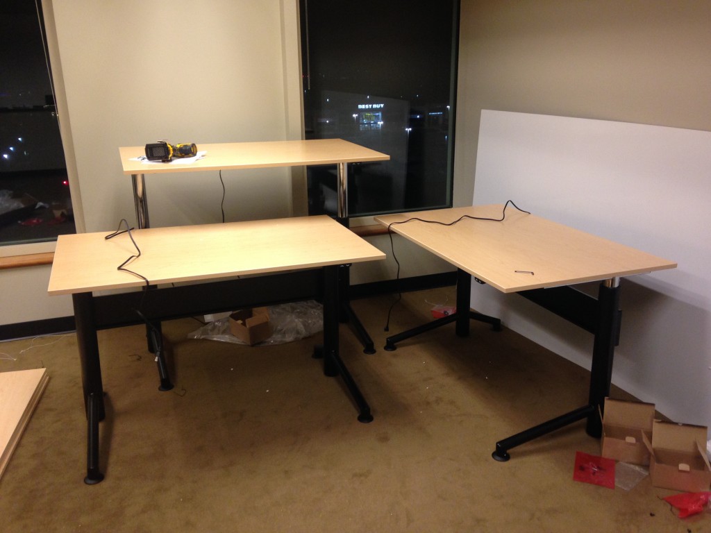 three motorized desks newly built with adjustable heights