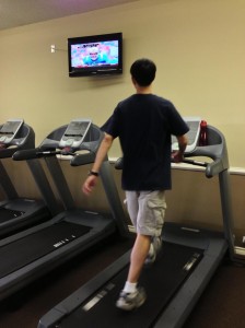 guy walking on treadmill with confident stride