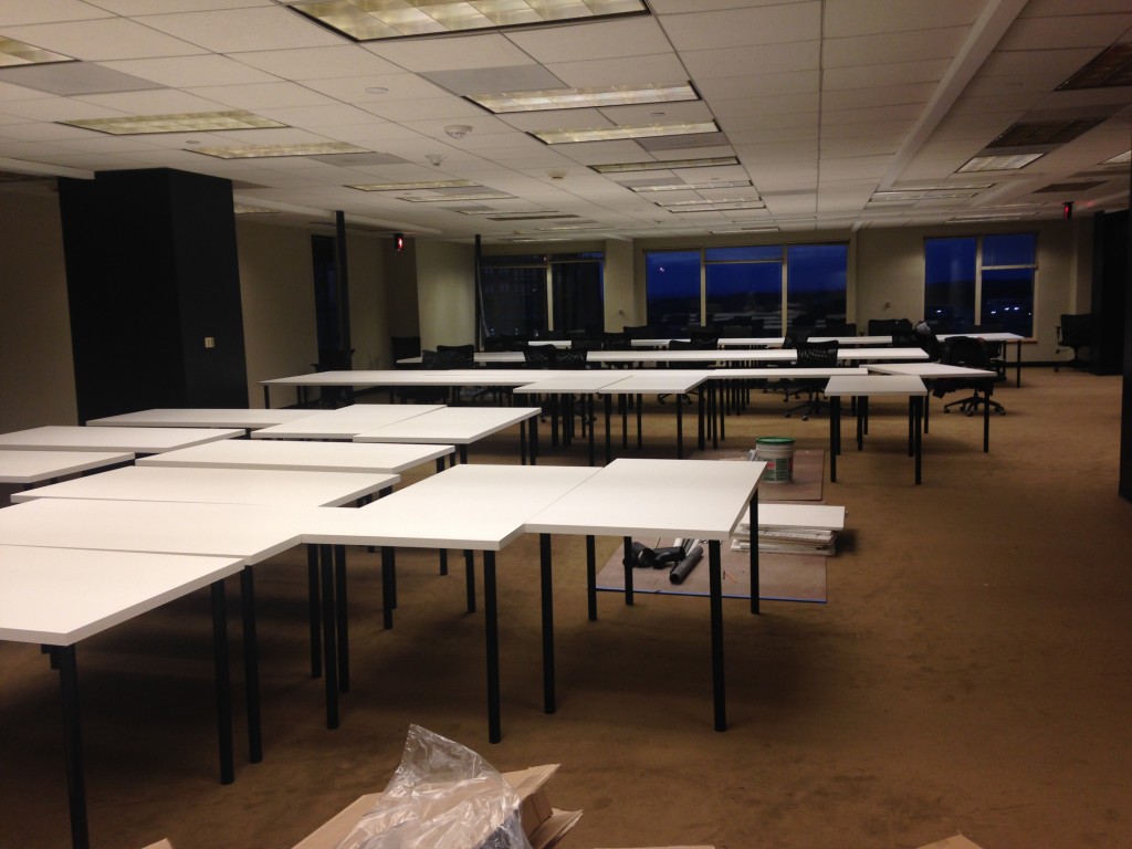 large room with tons of white desks