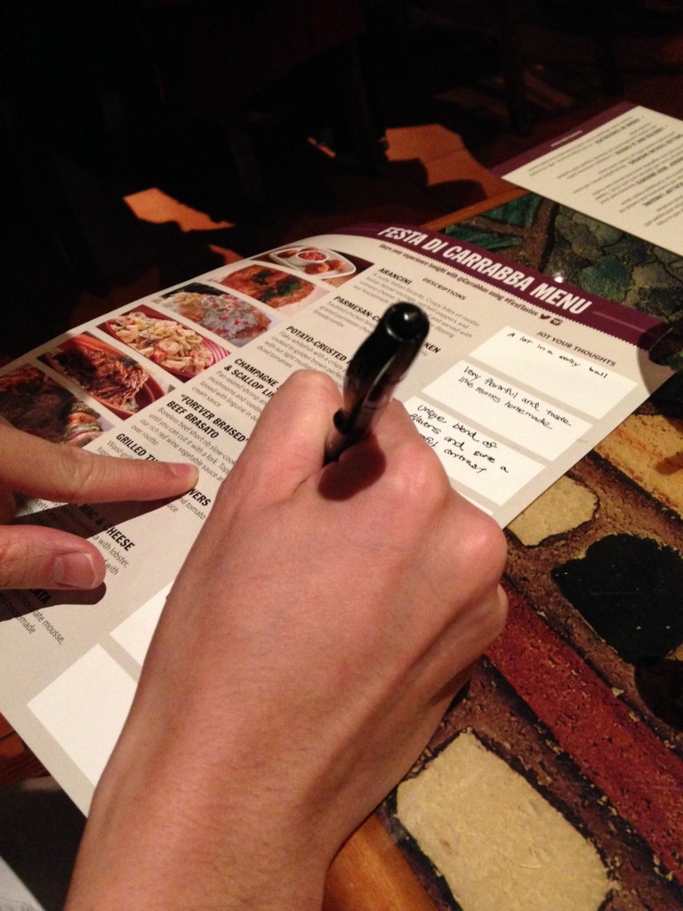 writing down thoughts of samples served at festa di carrabba first tastes event