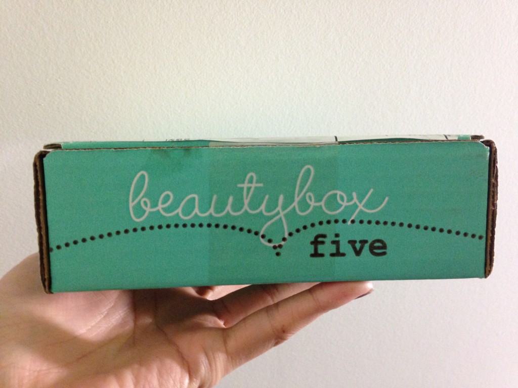 beauty box five held up by hand