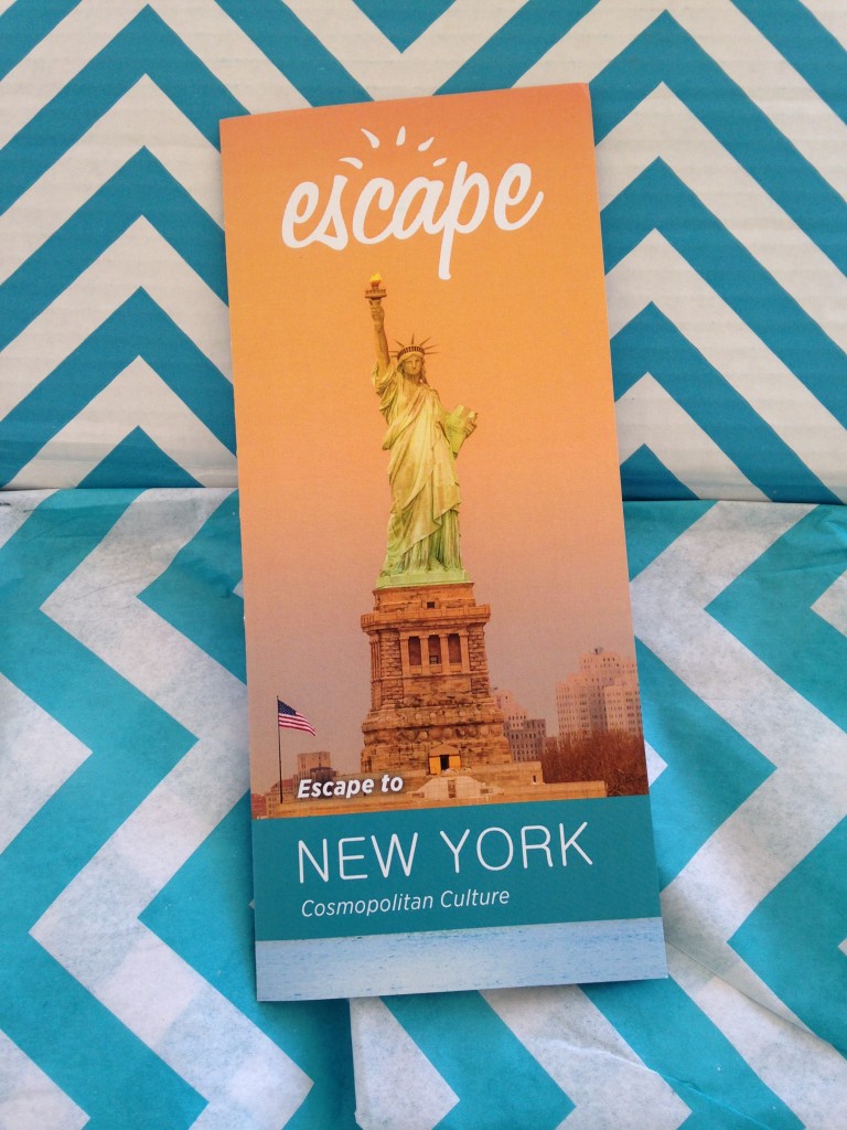 escape monthly february new york box info card against blue and white chevron background