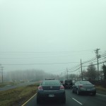 cars driving in thick fog of morning